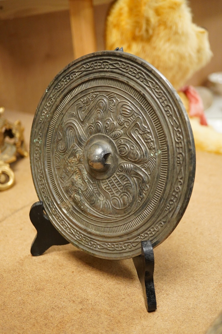 Chinese bronze ‘dragon’ mirror back, 19cm in diameter